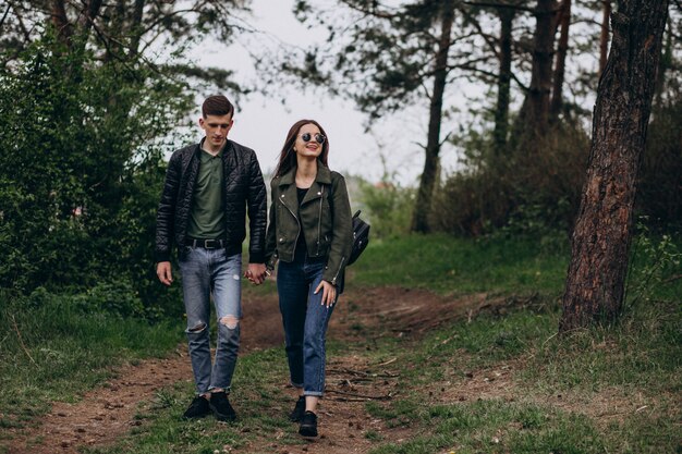 Young beautiful couple in the woods together