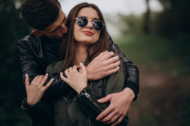 Young beautiful couple in the woods together