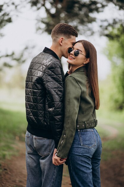 Young beautiful couple in the woods together