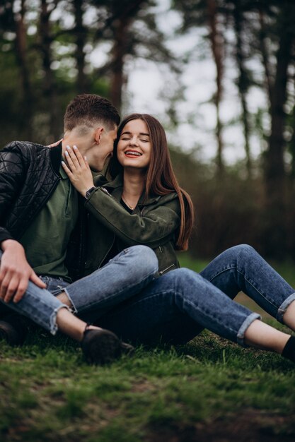 Young beautiful couple in the woods together