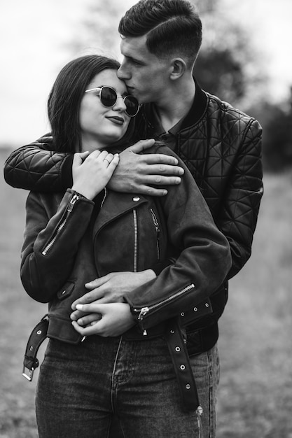 Young beautiful couple in the woods together