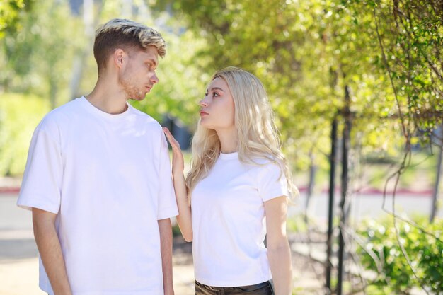 Young beautiful couples standing on and looking at each others High quality photo