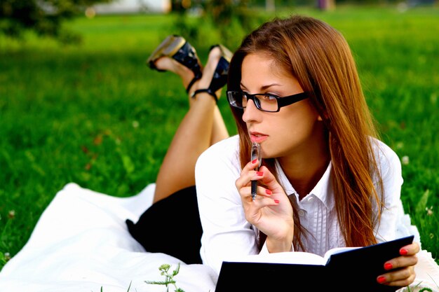 Young and beautiful girl doing home work