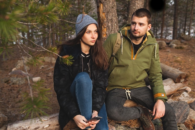 Young beautiful hipster man and woman in love traveling together in wild nature