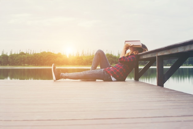 young beautiful hipster woman tired after reading put the book c