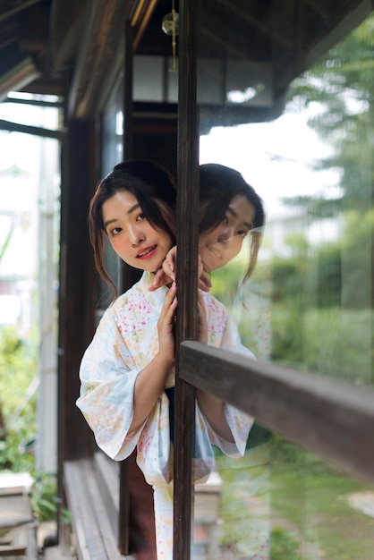 Young beautiful japanese woman wearing a traditional kimono