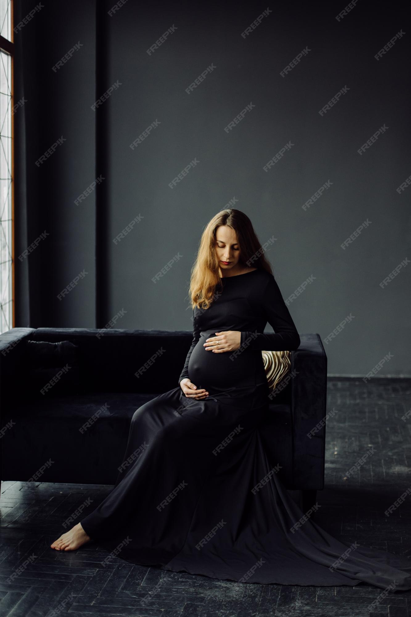 Free Photo | Young beautiful pregnant woman in black dress pregnancy  fashion look concept