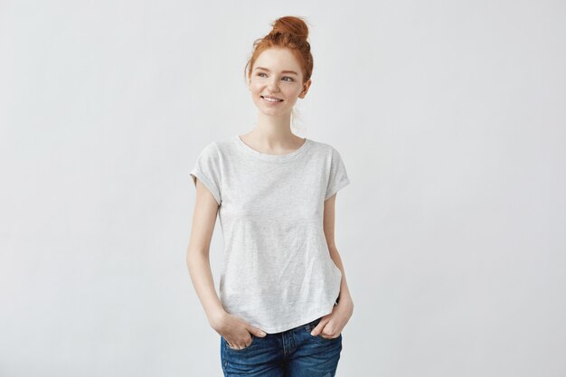 Young beautiful redhead woman smiling.