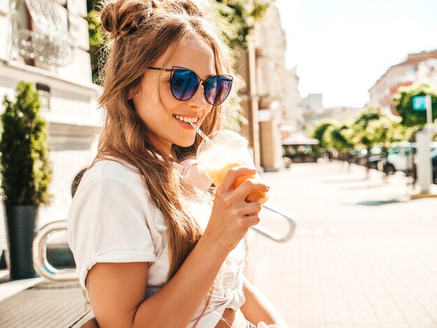 Young beautiful smiling hipster woman with afro curls hairstyle