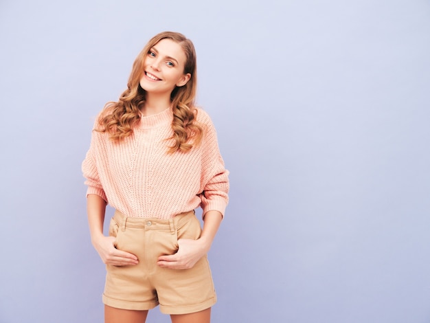 Young beautiful smiling woman in trendy summer clothes