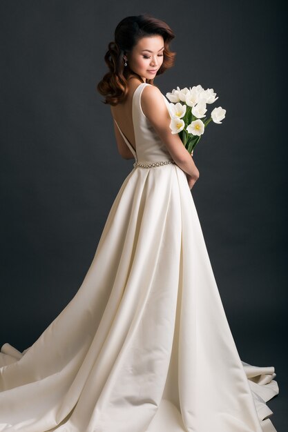 Young beautiful stylish woman in wedding dress