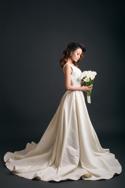 Young beautiful stylish woman in wedding dress