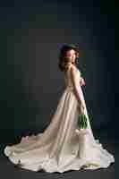 Free photo young beautiful stylish woman in wedding dress