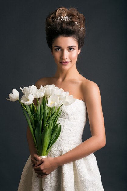 Young beautiful stylish woman in wedding dress