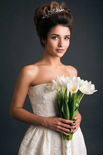 Young beautiful stylish woman in wedding dress