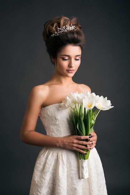 Free photo young beautiful stylish woman in wedding dress