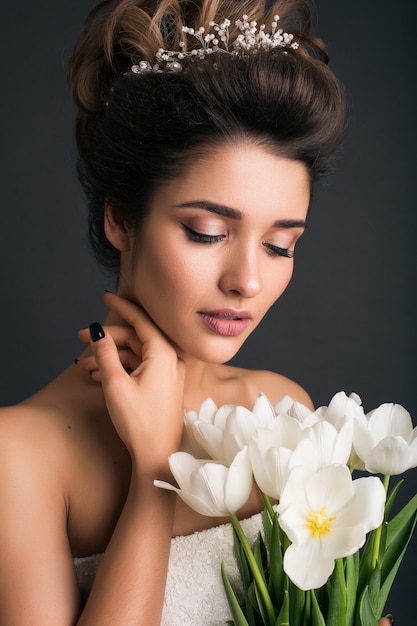 Young beautiful stylish woman in wedding dress