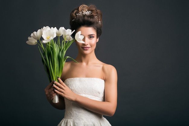 Young beautiful stylish woman in wedding dress