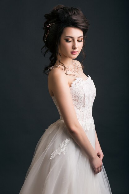 Young beautiful stylish woman in wedding dress