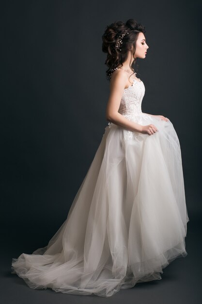 Young beautiful stylish woman in wedding dress