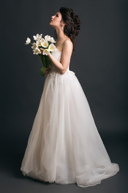 Young beautiful stylish woman in wedding dress