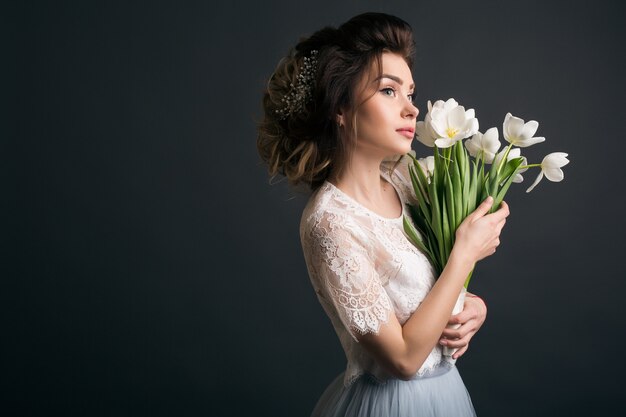 Young beautiful stylish woman in wedding dress