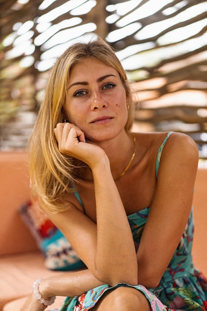 Free photo young beautiful woman in a cafe with a laptop works online.