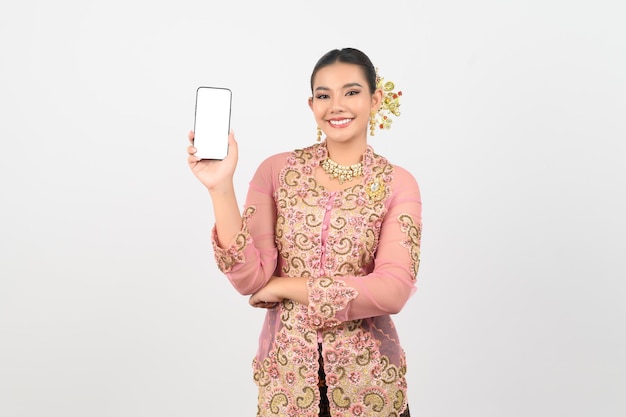 Young beautiful woman dress up in local culture in southern region pose with smartphone