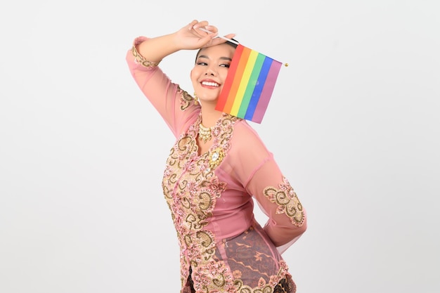 Free photo young beautiful woman dress up in local culture in southern region with rainbow flag