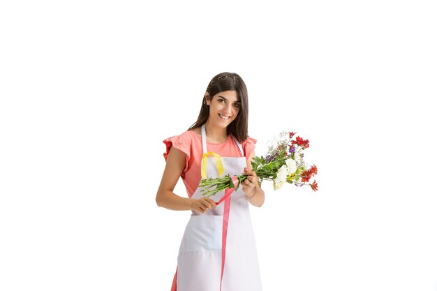 Young beautiful woman, florist with colorful fresh bouquet isolated on white studio