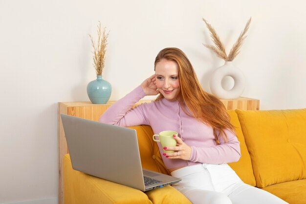 Young and beautiful woman having online meeting