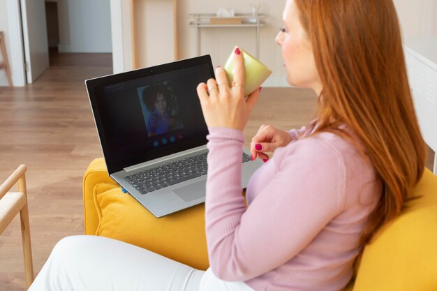 Young and beautiful woman having online meeting