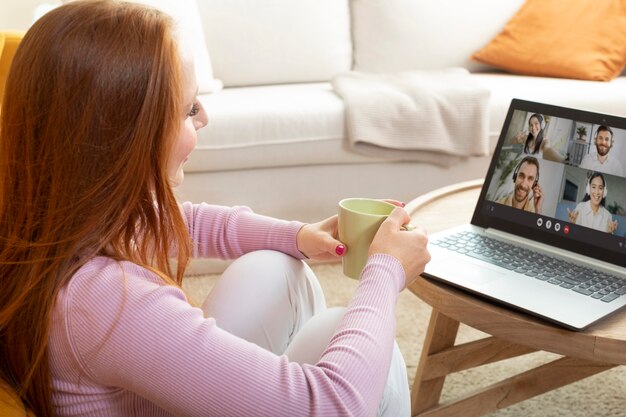 Young and beautiful woman having online meeting