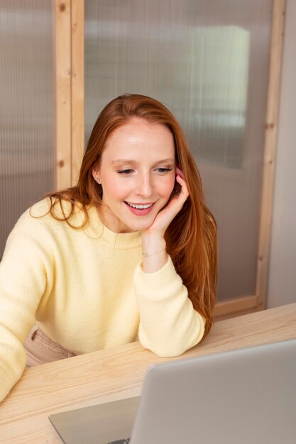 Young and beautiful woman having online meeting