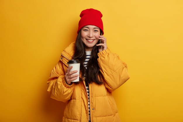 Young beautiful woman holding Christmas decorations