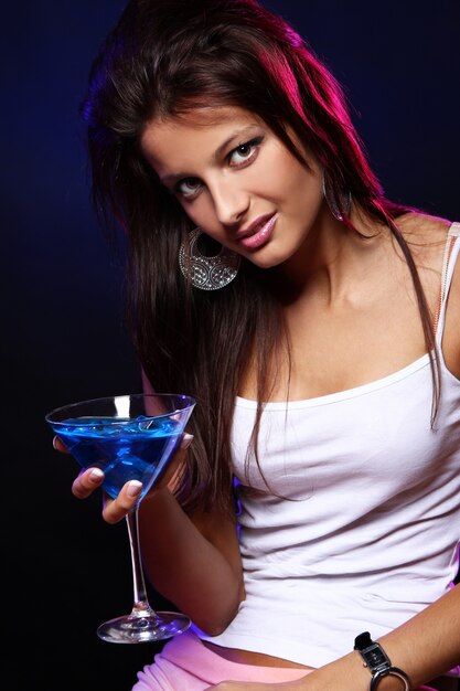 Young and beautiful woman in the nightclub