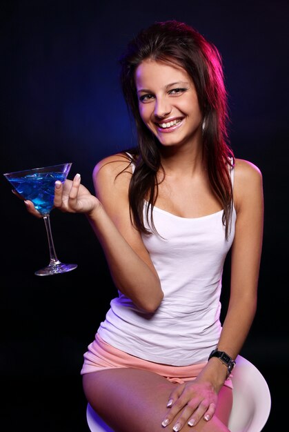 Young and beautiful woman in the nightclub