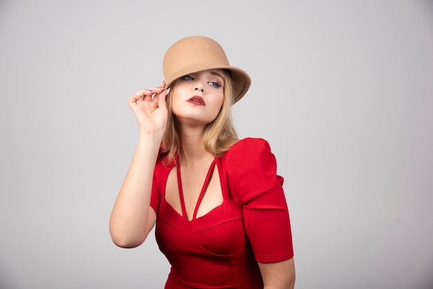 Young beautiful woman posing with hat.