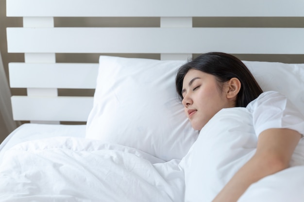 Young beautiful woman sleeping on the bed