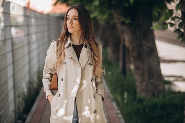 Young beautiful woman walking in a park