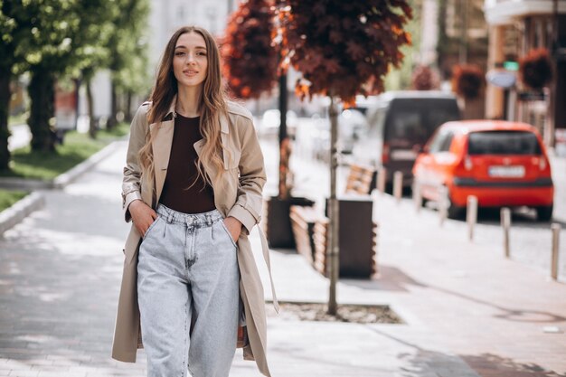 Young beautiful woman walking in a park