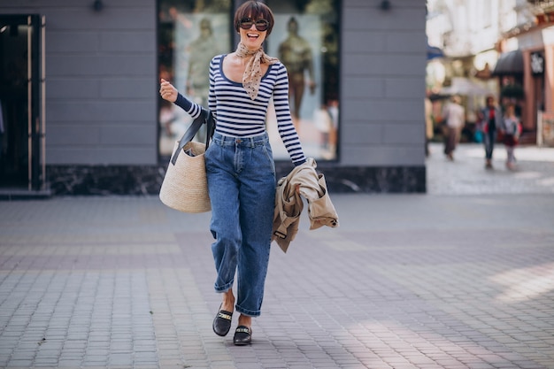 Young beautiful woman walking on a sunny day