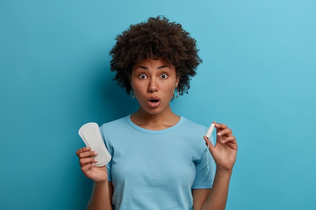 Young beautiful woman with curly hair isolated