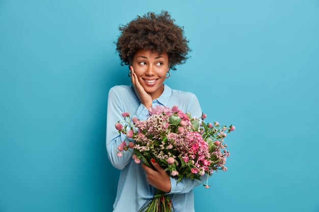 Young beautiful woman with curly hair isolated