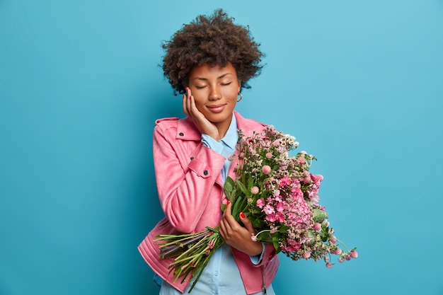 Young beautiful woman with curly hair isolated