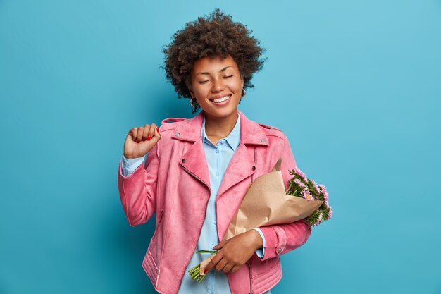 Young beautiful woman with curly hair isolated