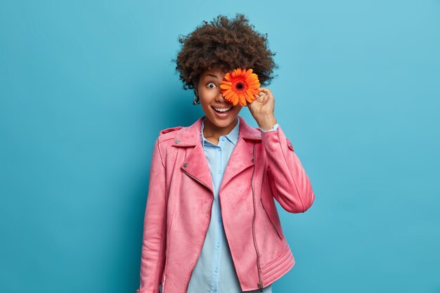 Young beautiful woman with curly hair isolated