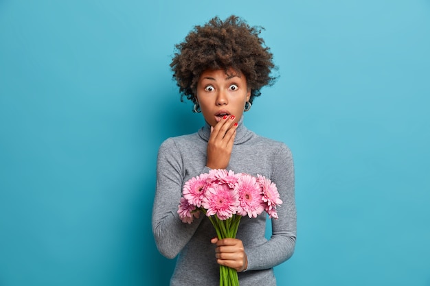 Free photo young beautiful woman with curly hair isolated