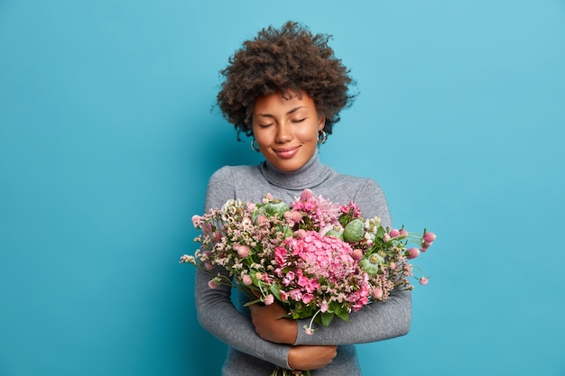 Free photo young beautiful woman with curly hair isolated