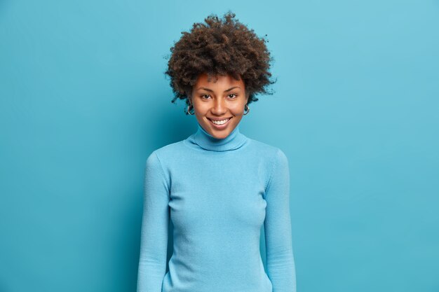 Young beautiful woman with curly hair isolated